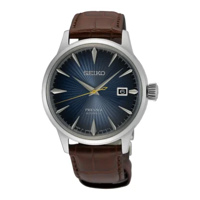 Seiko Presage Cocktail Blue Moon SRPK15J1 – Đồng hồ tự động Nhật Bản với mặt số xanh tinh tế, kim và cọc số mạ bạc, dây da cao cấp, thể hiện phong cách thời trang cổ điển.
